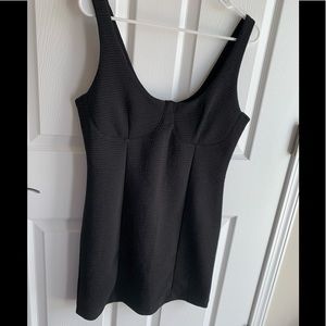 Black stretchy cocktail dress.